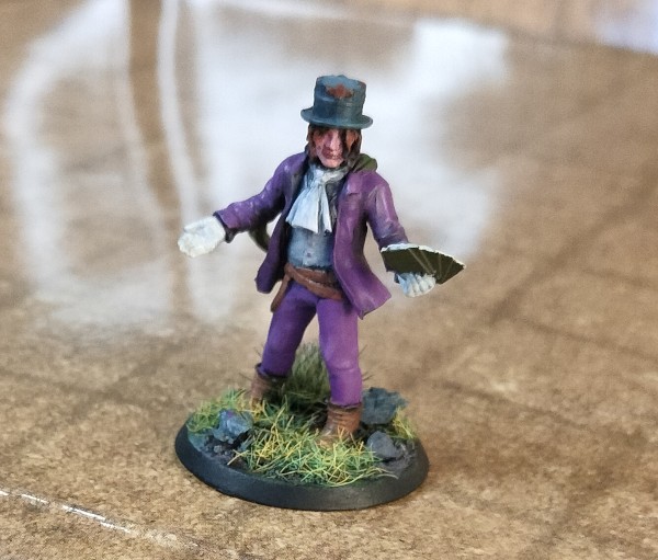 Vex’s mini: a human in a purple suit and top hat, standing in grass.