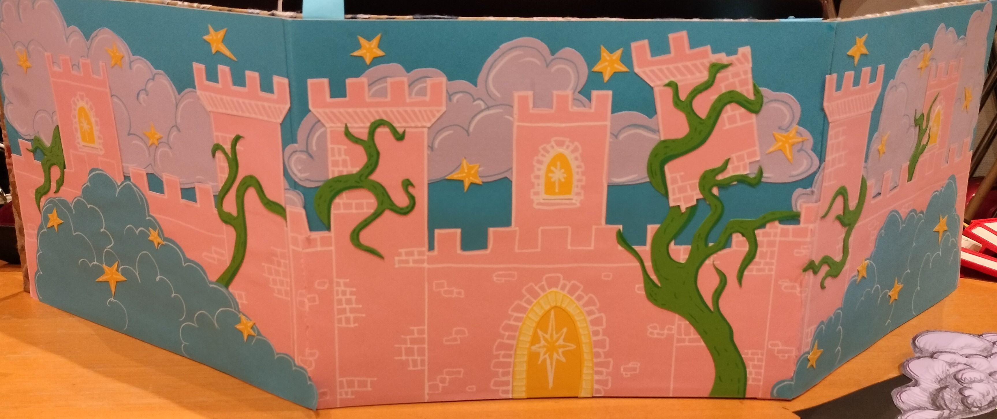 A DM screen depicting a castle.